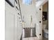 Bright foyer with hardwood floors, staircase, and half bathroom at 25 Grange Ct, Sharpsburg, GA 30277