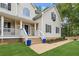Inviting front porch with stylish blue planters, leading to the home's entrance at 25 Grange Ct, Sharpsburg, GA 30277