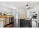 Spacious kitchen with an island, stainless steel appliances, granite countertops, and hardwood floors at 25 Grange Ct, Sharpsburg, GA 30277