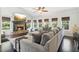 Spacious living room with a stone fireplace, high ceilings, and large sectional sofa at 25 Grange Ct, Sharpsburg, GA 30277