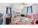 Spacious playroom with vaulted ceiling, vibrant decor, and plenty of room to play at 25 Grange Ct, Sharpsburg, GA 30277