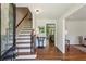 Bright foyer features hardwood floors, staircase, and views of living spaces at 3145 Indian Hills Ne Dr, Marietta, GA 30068