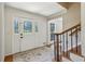 Cozy foyer with decorative glass door and a staircase to the upper floor at 3145 Indian Hills Ne Dr, Marietta, GA 30068