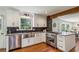 Updated kitchen features stainless steel appliances and black tile backsplash at 3145 Indian Hills Ne Dr, Marietta, GA 30068