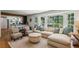 Bright living room featuring a large bay window, hardwood floors, and stylish neutral decor at 3145 Indian Hills Ne Dr, Marietta, GA 30068