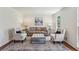 Formal living room with elegant furniture, a patterned rug, and recessed lighting at 3145 Indian Hills Ne Dr, Marietta, GA 30068