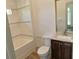 Bright bathroom with tiled shower, stone vanity, and large framed mirror at 4590 River Stone Trl, Douglasville, GA 30135