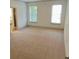Spacious bedroom with plush carpet and natural light, creating a relaxing retreat at 4590 River Stone Trl, Douglasville, GA 30135
