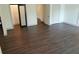 Bright bedroom with hardwood floors, closet, and doorways at 4590 River Stone Trl, Douglasville, GA 30135