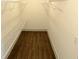 Walk-in closet with wire shelving and modern flooring at 4590 River Stone Trl, Douglasville, GA 30135