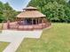 Exterior view of the community gazebo with picnic tables and covered deck at 4590 River Stone Trl, Douglasville, GA 30135