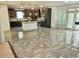 Spacious kitchen with a center island, dark cabinets, stainless appliances, and a door to the outside at 4590 River Stone Trl, Douglasville, GA 30135