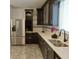 Stylish kitchen featuring dark cabinets, stainless steel appliances, and ample counter space at 4590 River Stone Trl, Douglasville, GA 30135