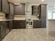 Modern kitchen with stainless steel appliances and dark cabinetry at 4590 River Stone Trl, Douglasville, GA 30135