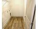 Small laundry room with shelving and hookups at 4590 River Stone Trl, Douglasville, GA 30135