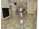 Spacious living room with tile flooring, fireplace, and staircase leading to the upper level at 4590 River Stone Trl, Douglasville, GA 30135