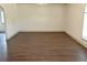 Spacious living room with dark wood flooring and bright neutral paint at 4590 River Stone Trl, Douglasville, GA 30135