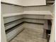 Well-organized pantry with ample shelving for storing groceries and kitchen essentials at 4590 River Stone Trl, Douglasville, GA 30135