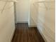 Spacious walk-in closet with custom shelving, providing ample storage space and organization at 4590 River Stone Trl, Douglasville, GA 30135