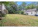 Expansive backyard showcasing a large grassy area, perfect for outdoor activities and entertaining at 1052 Curran Nw St, Atlanta, GA 30318
