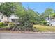 Charming home with a stone-accented yard, offering classic appeal and a inviting entrance at 1052 Curran Nw St, Atlanta, GA 30318