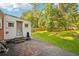 Backyard features a concrete patio area with adjacent lush green lawn, enclosed by a wooden fence at 1521 Deerwood Dr, Decatur, GA 30030