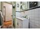 Cozy bathroom featuring white tiled walls, and a sink with a mirror and vanity at 1521 Deerwood Dr, Decatur, GA 30030