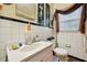 Bathroom featuring white tile walls, and a sink with a mirror and vanity at 1521 Deerwood Dr, Decatur, GA 30030