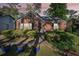 Charming brick home with a well-kept front yard, mature trees, and an inviting entrance at 1521 Deerwood Dr, Decatur, GA 30030