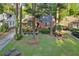 Charming brick home with well-maintained front yard, mature trees, and a welcoming entrance at 1521 Deerwood Dr, Decatur, GA 30030