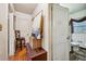 Hallway featuring hardwood floors, and a peek into the connected bathroom at 1521 Deerwood Dr, Decatur, GA 30030