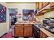 Functional kitchen with stainless steel appliances, window, and dark cabinetry and flooring at 1521 Deerwood Dr, Decatur, GA 30030