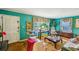 Inviting living room with vintage charm, featuring turquoise walls, patterned curtains, and classic furnishings at 1521 Deerwood Dr, Decatur, GA 30030