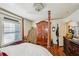 Bedroom featuring hardwood floors, natural light, large dresser, and large armoire at 1521 Deerwood Dr, Decatur, GA 30030
