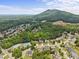 Suburban community with two-story homes nestled among trees and green landscapes at 1850 Overlook Springs Ln, Cumming, GA 30040