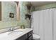 Bathroom with vanity and white shower curtain at 1850 Overlook Springs Ln, Cumming, GA 30040