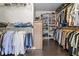 Walk-in closet featuring extensive shelving and hanging space for clothes and shoe storage at 1850 Overlook Springs Ln, Cumming, GA 30040