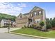 Beautiful two-story brick home with manicured lawn and landscaping at 1850 Overlook Springs Ln, Cumming, GA 30040