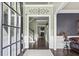 Welcoming foyer features a decorative light fixture, hardwood floors, and views into other rooms in the house at 1850 Overlook Springs Ln, Cumming, GA 30040