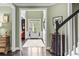 Inviting foyer leads to the front door and living areas with hardwood floors at 1850 Overlook Springs Ln, Cumming, GA 30040