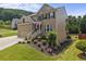 Attractive two-story home with brick and siding, plus a nicely landscaped front yard at 1850 Overlook Springs Ln, Cumming, GA 30040
