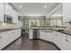 Bright eat-in kitchen features white cabinets, stainless appliances and a large apron sink at 1850 Overlook Springs Ln, Cumming, GA 30040