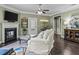 Cozy living room showcasing a fireplace, comfortable seating, and elegant decor details at 1850 Overlook Springs Ln, Cumming, GA 30040