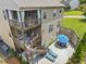 Two-story home with a tiered deck, outdoor lounge area, and patio seating at 1850 Overlook Springs Ln, Cumming, GA 30040
