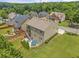 Two-story home showcasing a large backyard, patio, and tiered deck at 1850 Overlook Springs Ln, Cumming, GA 30040