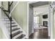 Staircase leading to a living room with fireplace and modern decor at 1850 Overlook Springs Ln, Cumming, GA 30040