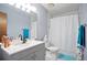 Bright bathroom with a white vanity, modern fixtures, and a shower-tub combo at 189 Timber Creek Ln, Marietta, GA 30060