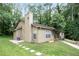Charming home featuring a cozy patio, verdant lawn and delightful flower box, all nestled in a peaceful, wooded lot at 189 Timber Creek Ln, Marietta, GA 30060