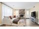 Bright living room featuring a stone fireplace, modern sofa, and ample natural light at 189 Timber Creek Ln, Marietta, GA 30060