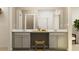 Modern bathroom featuring double vanity, decorative stool, and large mirror at 2340 Treaty Ln, Douglasville, GA 30135